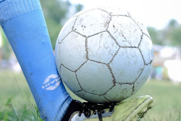 leg holding soccer ball