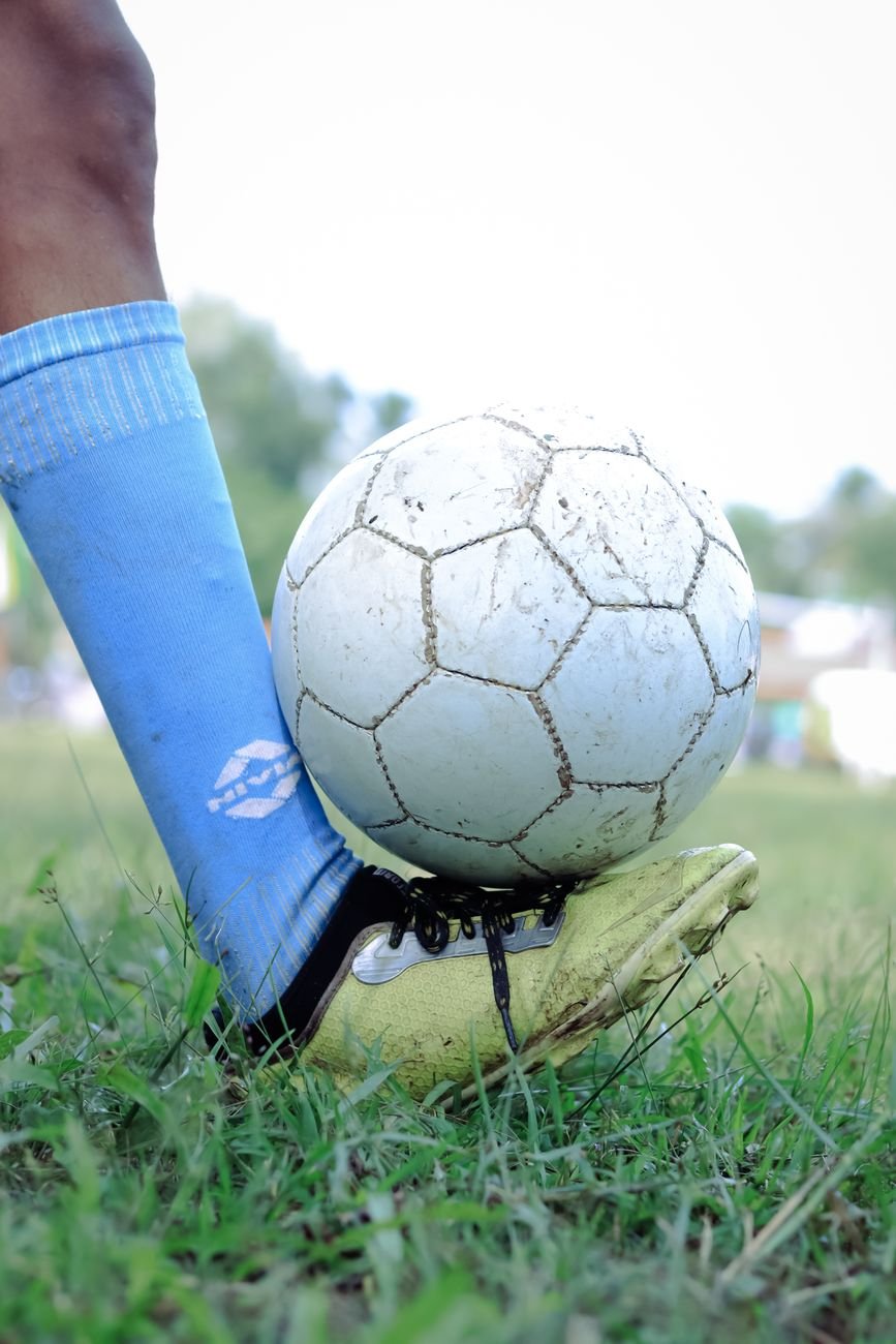 leg holding soccer ball